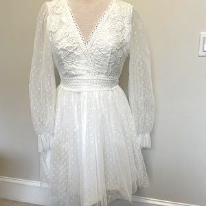 “Simplee” white dress with a v-neck sheer sleeves with circles